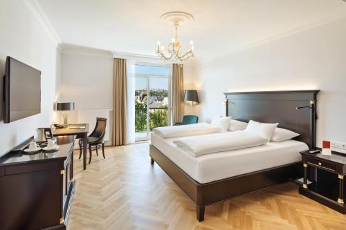 Кровать или кровати в номере Austria Trend Parkhotel Schönbrunn Wien