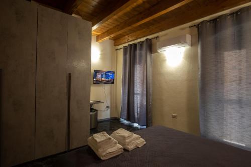 TV a/nebo společenská místnost v ubytování Via Cavour 19, Camere del Conte