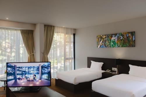 Postel nebo postele na pokoji v ubytování Terracotta Hotel & Resort Dalat