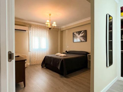 Postel nebo postele na pokoji v ubytování Apartamento Góngora