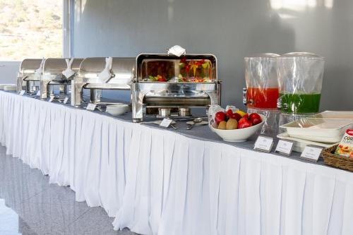 a buffet line with food on a table at Memora Chapala in Chapala