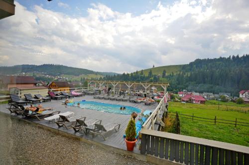 a view of a swimming pool in a resort at Villa Loiza in Bukovel