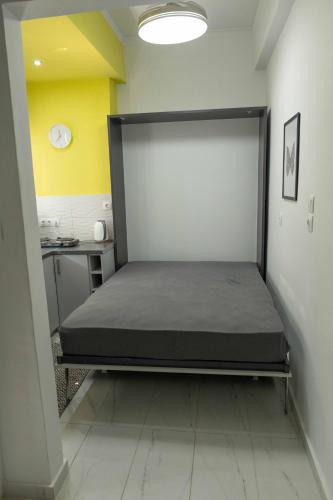 Postel nebo postele na pokoji v ubytování ΑΙΘΡΑ Suite