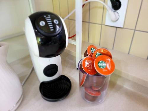 a hair dryer sitting on a counter next to some tomatoes at Donghae Hanok Stay in Donghae