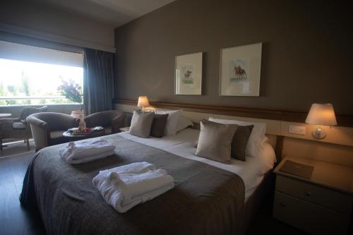 Katil atau katil-katil dalam bilik di Alasia Boutique Hotel