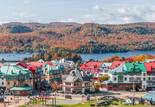 an aerial view of a town with fall foliage at Cozy Chalet on the 9th Hole La Bête Pool Golf in Mont-Tremblant