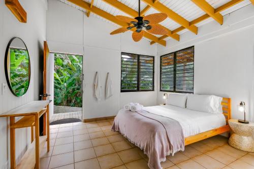 a bedroom with a bed and a ceiling fan at Casa Grande Mountain Retreat - Adults Only in Utuado