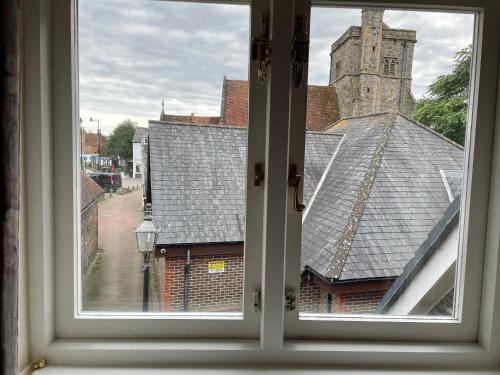 an open window with a view of a church at Aleberry Bed and Breakfast in Lewes