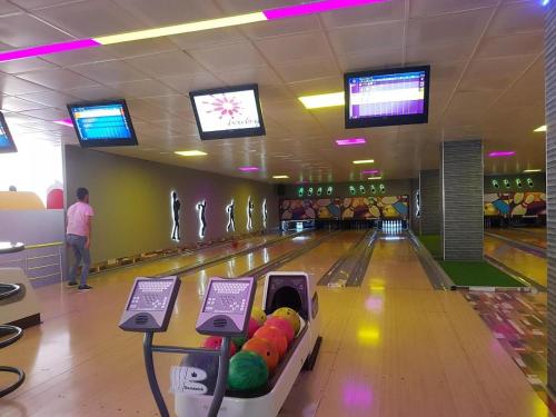a bowling alley with balls on the lanes at A dream house with a dream view in ROYAL PARK in Alanya
