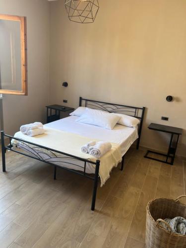 a bedroom with a bed with towels on it at Cecco Guest house in Pisa
