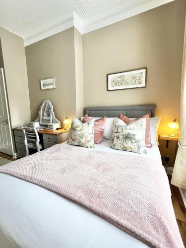 Ένα ή περισσότερα κρεβάτια σε δωμάτιο στο Devon House Guest House