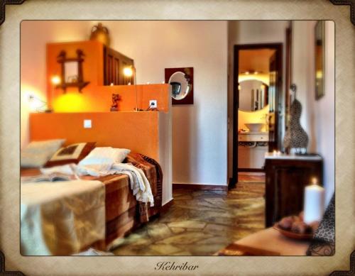 Ein Bett oder Betten in einem Zimmer der Unterkunft Aperanto Galazio