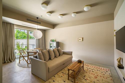 a living room with a couch and a table at Rezident Tomis Marina in Constanţa