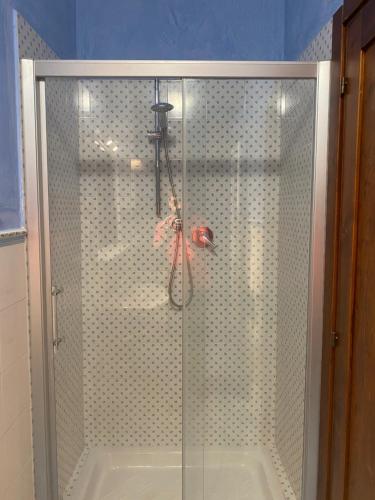 a shower with a glass enclosure in a bathroom at Il Belvedere sul Conero in Potenza Picena