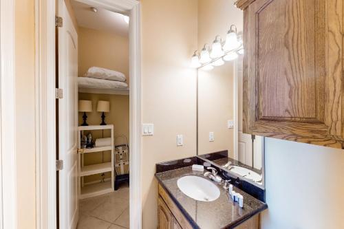 a bathroom with a sink and a mirror at Escape Condominiums #7 in South Padre Island