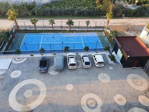 an overhead view of cars parked in a parking lot next to a pool at A dream house with a dream view in ROYAL PARK in Alanya
