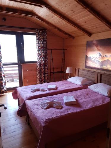 Postel nebo postele na pokoji v ubytování Villa Dabderr Mestia