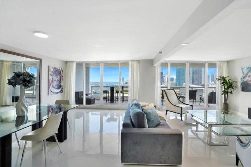a living room with a couch and a glass table at Meet Me in Miami! Impressive Miami Skyline Views in Miami