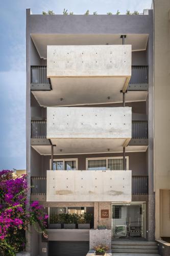an exterior view of a building with a large concrete wall at Heated Luxury Poolside Retreat in St Julian s in Pembroke 