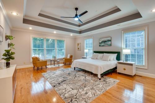 a bedroom with a bed and a living room at Grand Lakefront Home in Hartwell with Game Room! in Hartwell