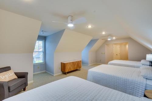 a bedroom with two beds and a couch and a window at Grand Lakefront Home in Hartwell with Game Room! in Hartwell