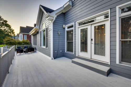a large deck with chairs on a house at Grand Lakefront Home in Hartwell with Game Room! in Hartwell