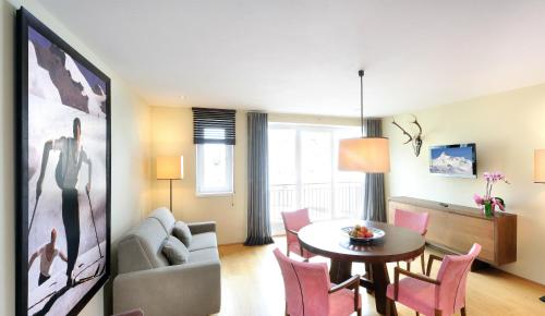a living room with a couch and a table at Apparthotel Sonne in Obertauern