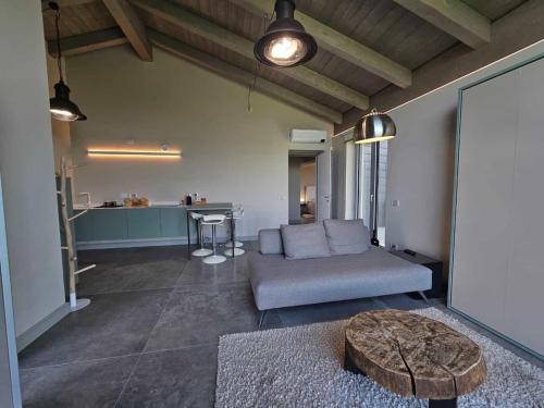 a living room with a couch and a table at Ca' del magu in San Michele Mondovì