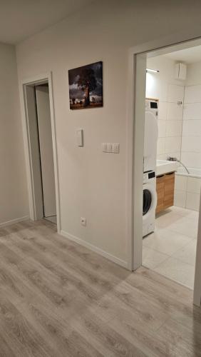 a bathroom with a toilet and a sink in a room at 2 room Apartment with terrace, new building, 2BL in Bratislava