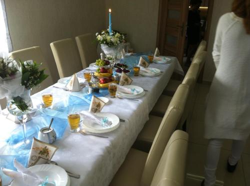 a long table with plates of food on it at Willa Szus in Koniaków