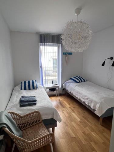 מיטה או מיטות בחדר ב-Mellbystrand Björkvägen Apartment