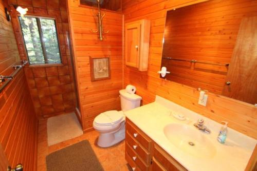 a bathroom with a toilet and a sink and a shower at 2 bedroom, 2 bath, sleeps 6 adults West End of Donner Lake DLR#021 in Truckee