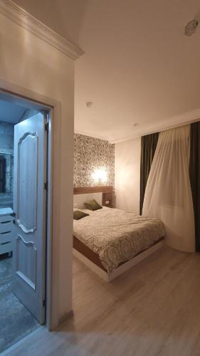 Postel nebo postele na pokoji v ubytování Orophile guest house