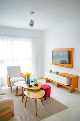 a living room with a couch and a table at Playa Palmera Beach Resort in Punta Cana