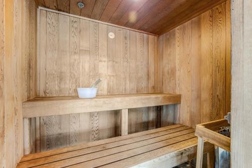 a wooden sauna with a bowl on a shelf at Bear Trap Dunes---26 Willow Oak Ave in Ocean View