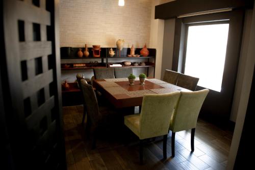 a dining room with a table and chairs and a window at Hotel Internacional in Comitán de Domínguez