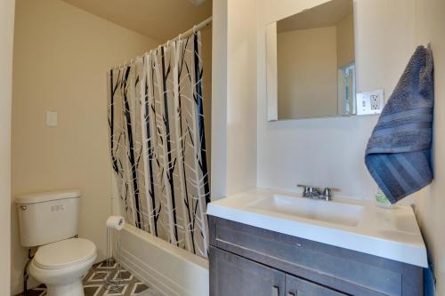 a bathroom with a sink and a toilet and a mirror at Hatboro Retreat Steps From Shopping and Dining! 