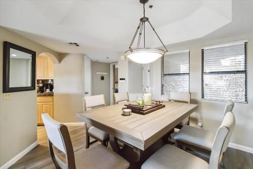 a dining room with a wooden table and chairs at Biltmore Bliss Desert Retreat! in Phoenix