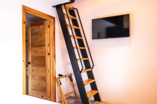TV a/nebo společenská místnost v ubytování Hostal de la Montaña