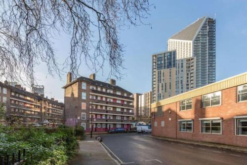 a street in a city with tall buildings at APlaceToStay Central London apartment, Zone 1 LEIC in London