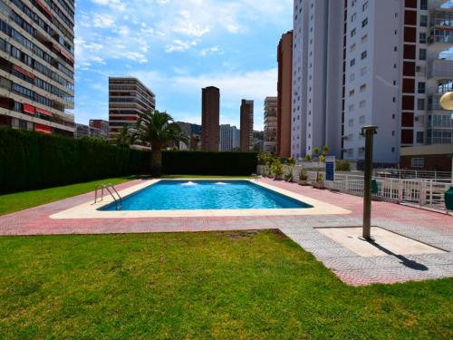 a swimming pool in the middle of a city at Benidorm Carolina Beach & Pool in Benidorm