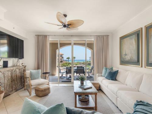 a living room with a couch and a ceiling fan at San Remo Condominium 209 by Newman-Dailey in Santa Rosa Beach