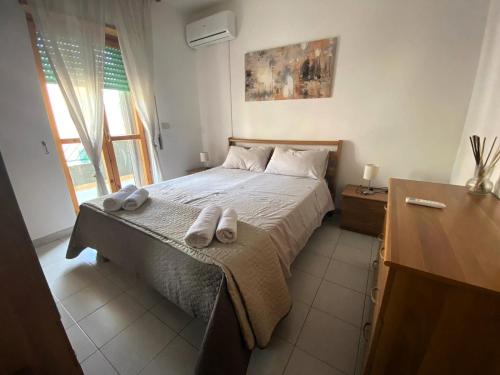 Ένα ή περισσότερα κρεβάτια σε δωμάτιο στο Casa vacanze con terrazza