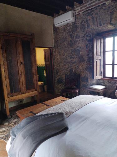 Cama o camas de una habitación en Hacienda Las Amantes