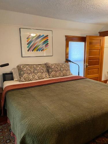 a bedroom with a large bed in a room at Burnt Toast Inn in Ann Arbor