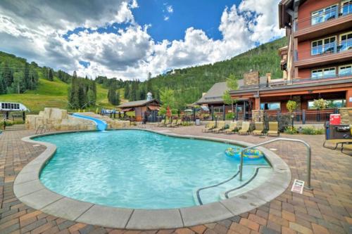 a large swimming pool in front of a hotel at Twilight View in Durango Mountain Resort