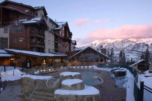 a resort with a swimming pool in the snow at Twilight View in Durango Mountain Resort