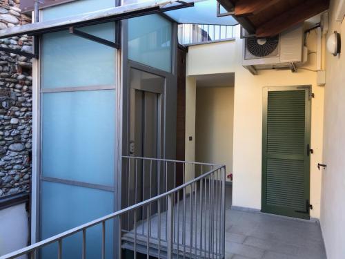 a pivot door in a house with a stairway at S a p p h i r e H o M e - Rivarolo DesignApartment in Rivarolo Canavese
