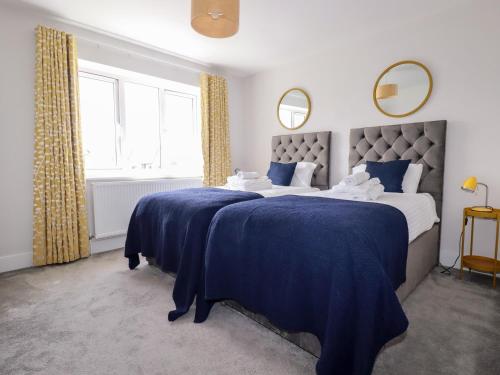 Ένα ή περισσότερα κρεβάτια σε δωμάτιο στο Chi Gwynn