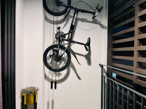 a bike is hanging on a wall at Selayang 18 Residences (with Wifi 300Mbps) in Batu Caves